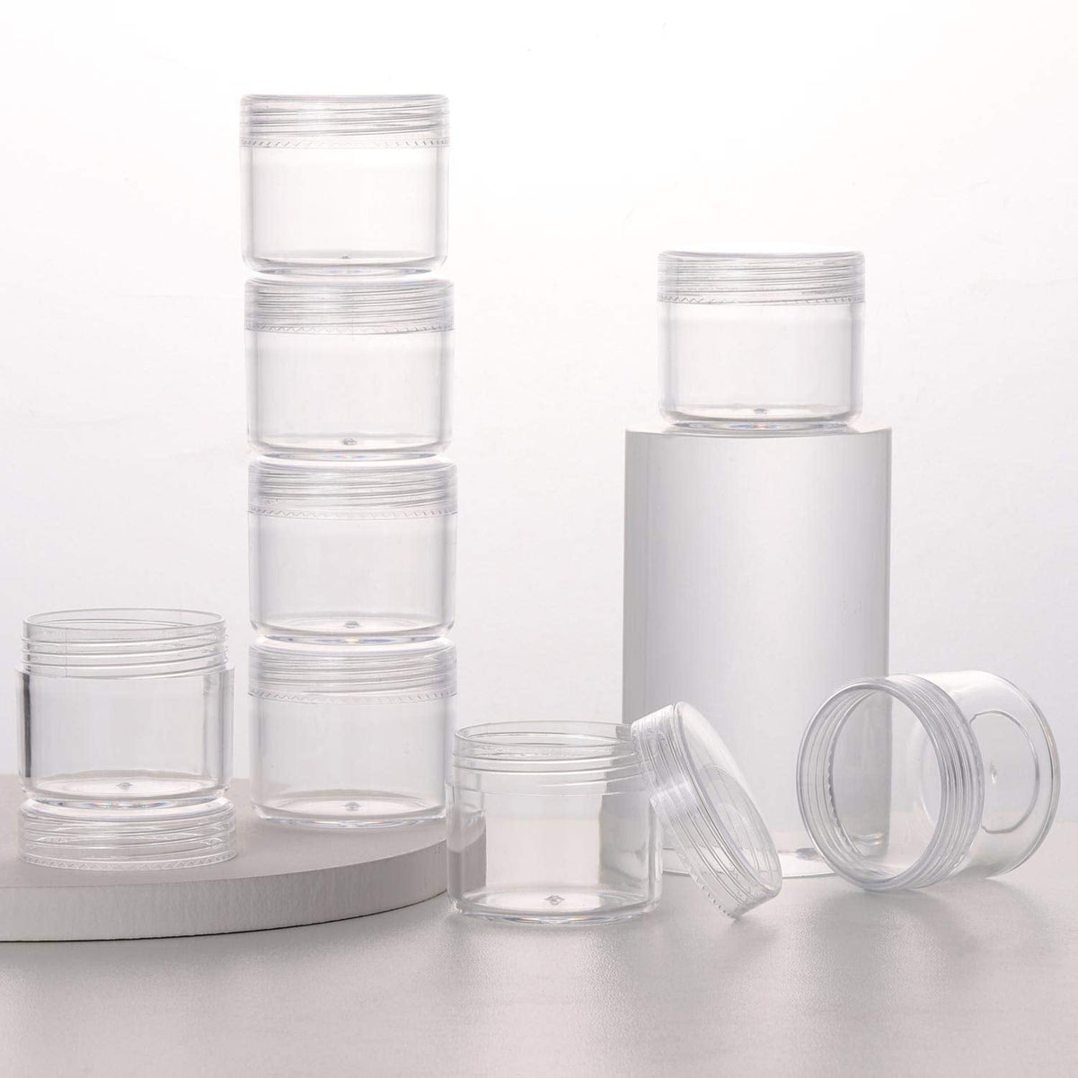 Refillable Cosmetic Sample Jars - 100 Pack 20g (0.7oz) Clear Small Travel Containers with Lids + 10 Mini Makeup Spatulas - BPA Free