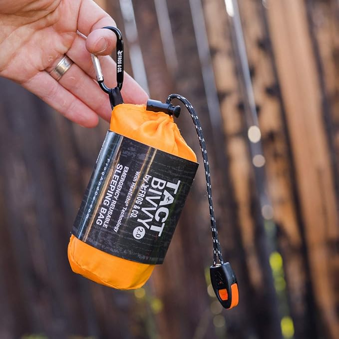 Survival Frog Tact Bivvy 2.0 Emergency Sleeping Bag w/Stuff Sack, Carabiner, Survival Whistle, ParaTinder - Compact, Lightweight, Waterproof, Reusable, Thermal Bivy Sack Cover, Shelter Kit
